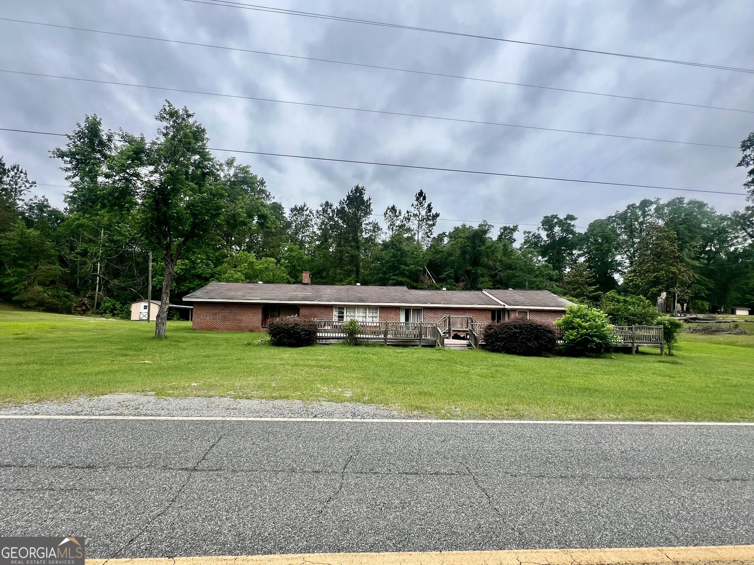 1165 Jaybird Springs Road Chauncey, GA 31011 - Photo 2 of 43 a house view with a garden space