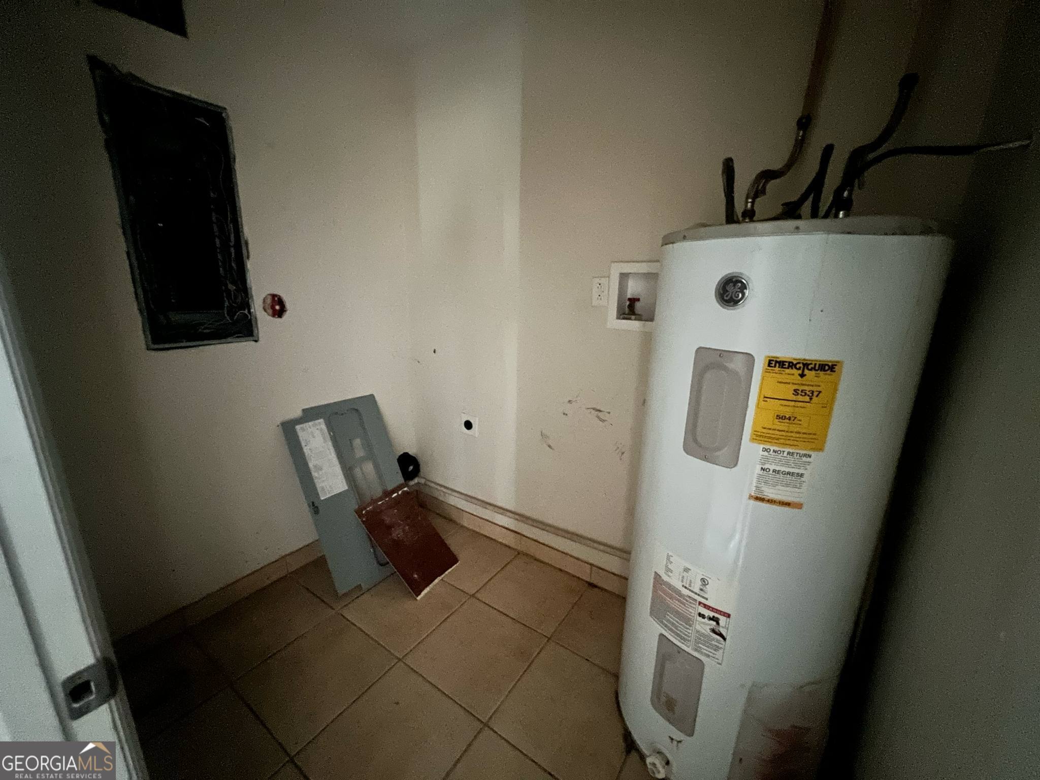 1165 Jaybird Springs Road Chauncey, GA 31011 - Photo 27 of 43 a view of storage and utility room with two washing machine