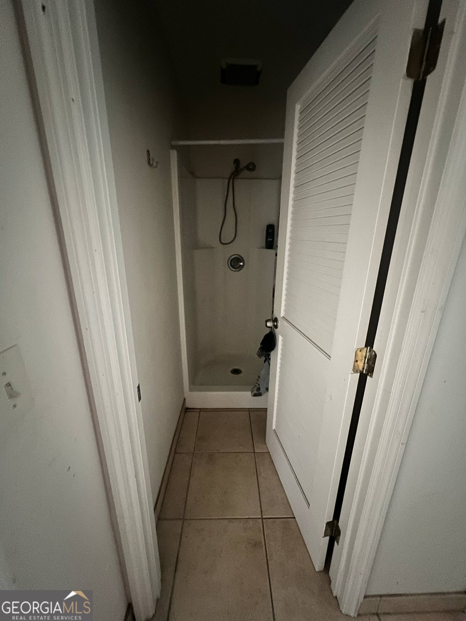 1165 Jaybird Springs Road Chauncey, GA 31011 - Photo 29 of 43 a bathroom with a glass door shower