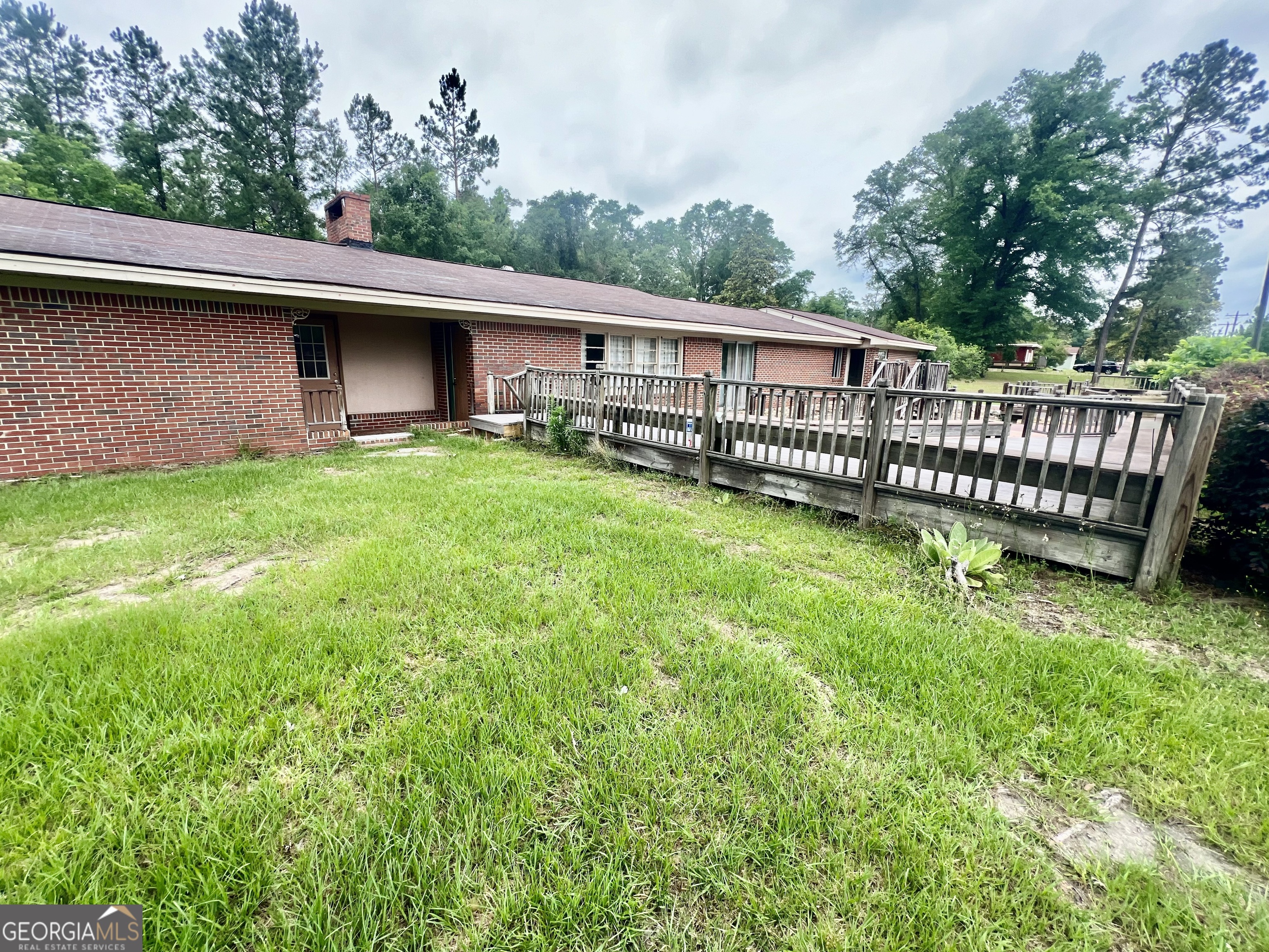 1165 Jaybird Springs Road Chauncey, GA 31011 - Photo 3 of 43 a view of a backyard with a garden