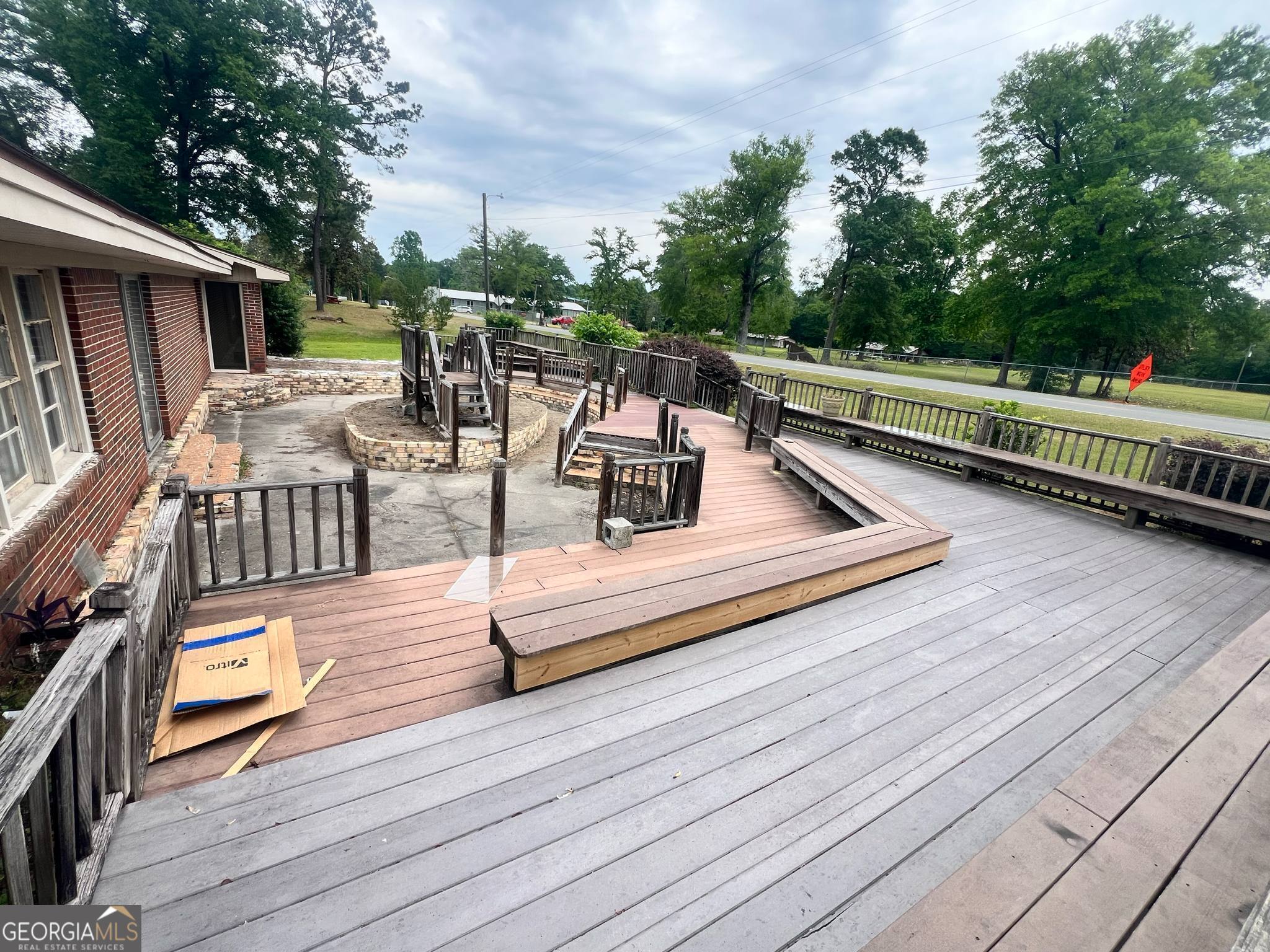 1165 Jaybird Springs Road Chauncey, GA 31011 - Photo 34 of 43 a roof deck with wooden floor and seating space