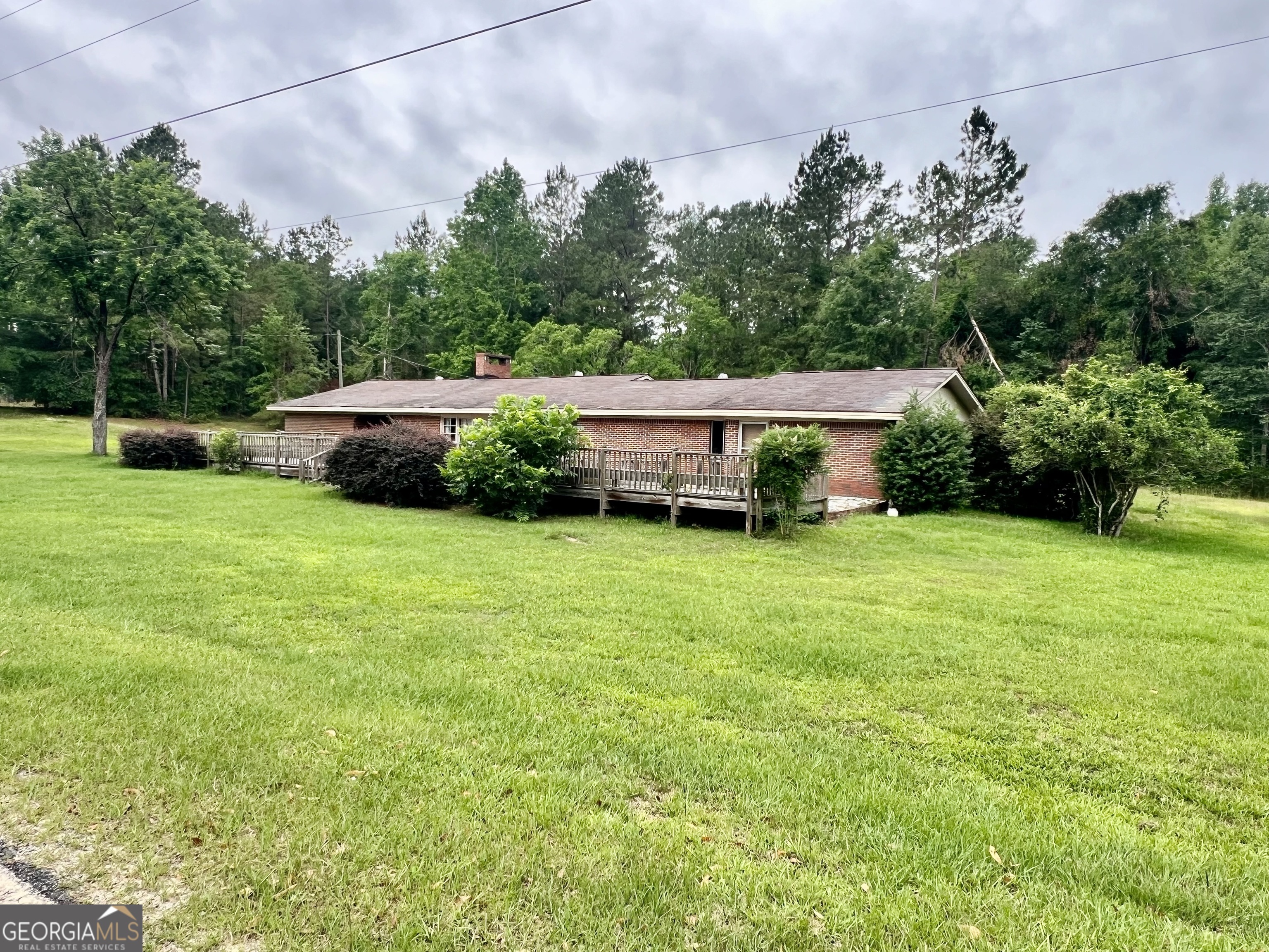 1165 Jaybird Springs Road Chauncey, GA 31011 - Photo 42 of 43 a view of a house with backyard and sitting area