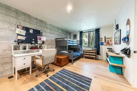 a room with furniture a flat screen tv and a table