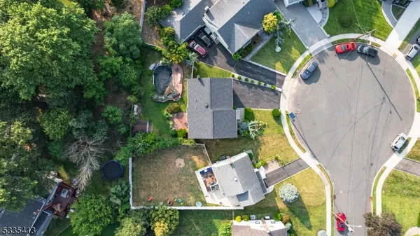 an aerial view of a house with swimming pool