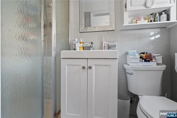 a bathroom with a toilet sink and vanity