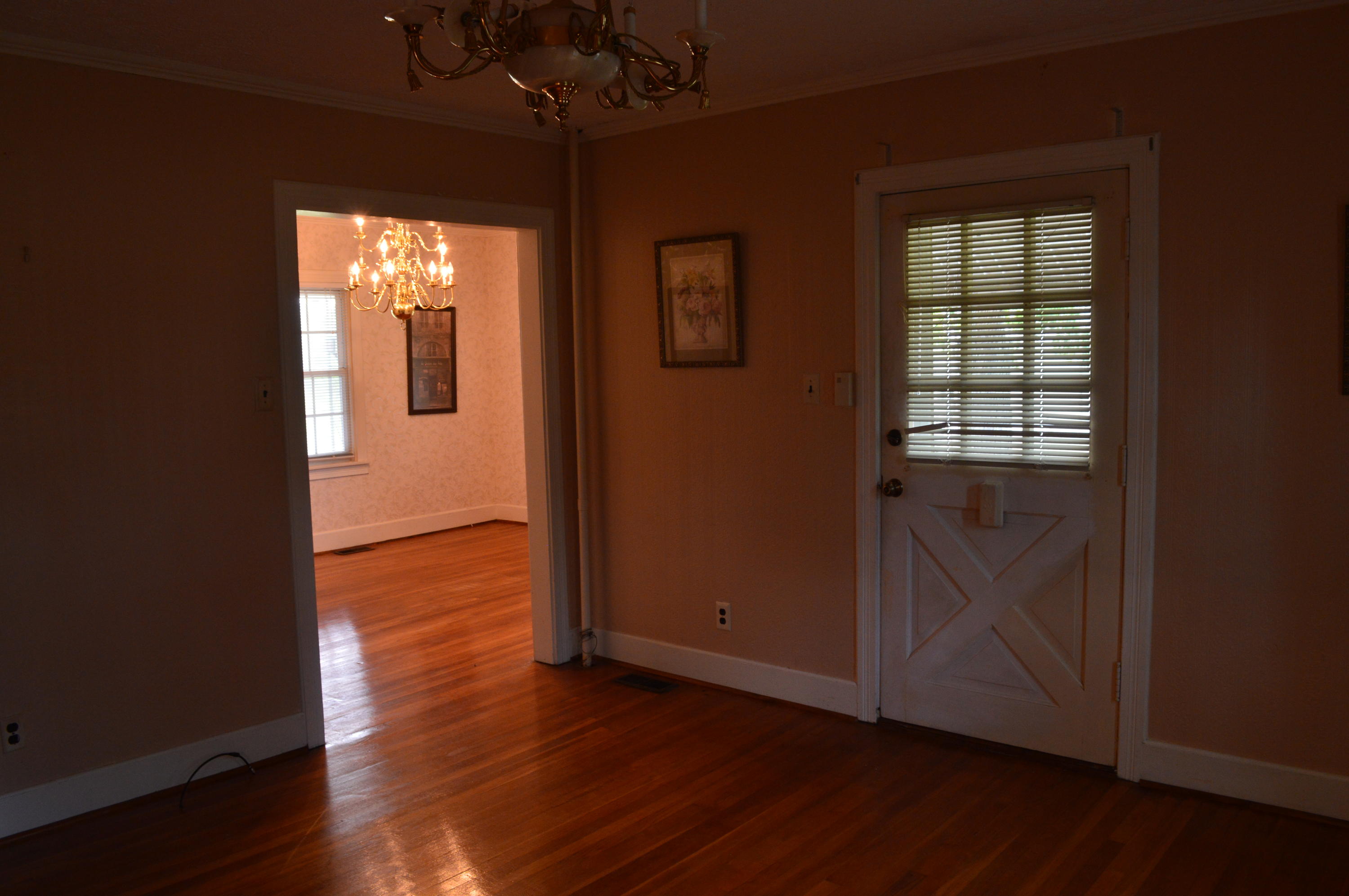 8745 Callands Road Chatham, VA 24531 - Photo 16 of 37 an empty room with wooden floor and windows