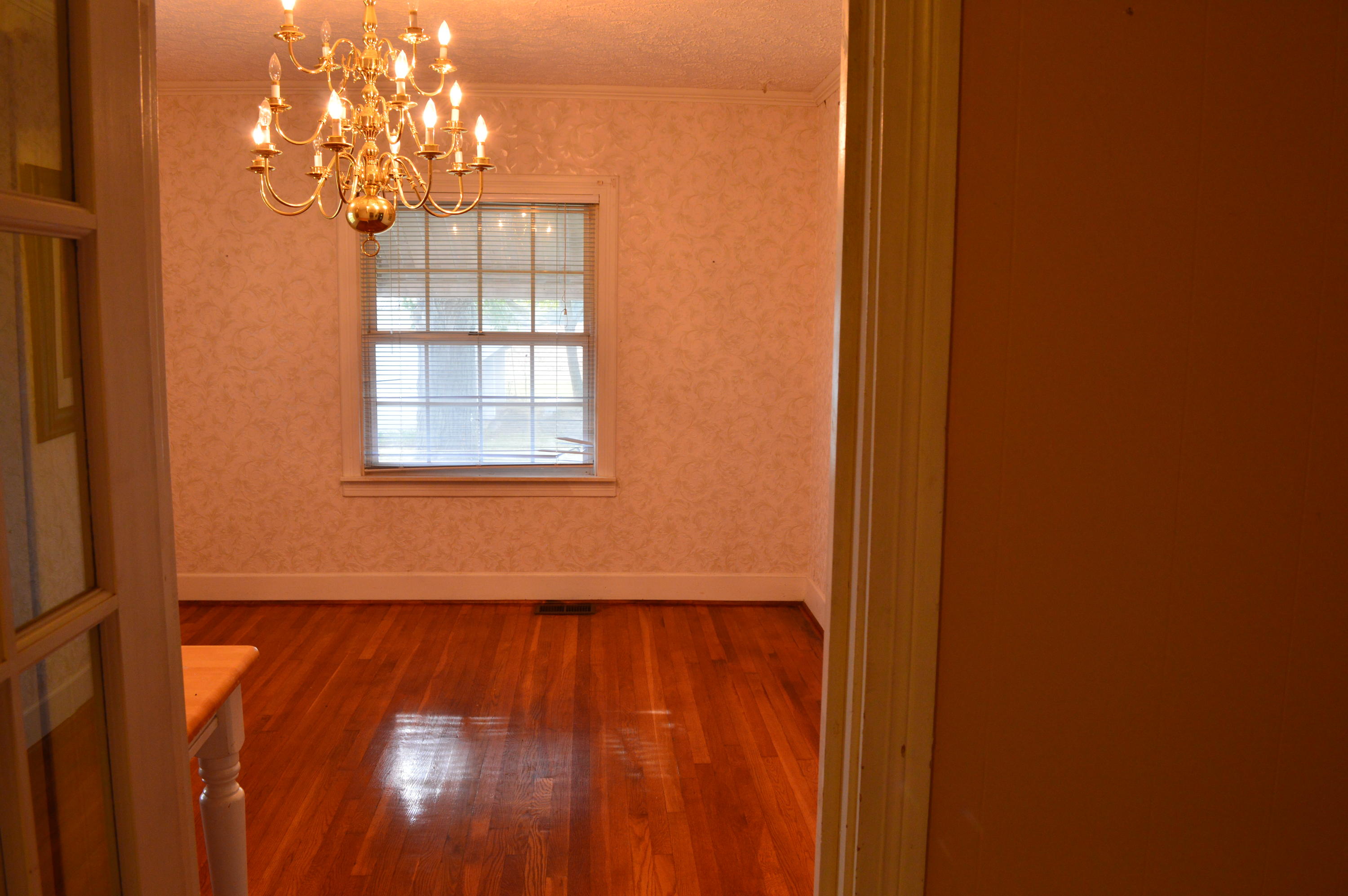 8745 Callands Road Chatham, VA 24531 - Photo 18 of 37 a view of an empty room with wooden floor and a window