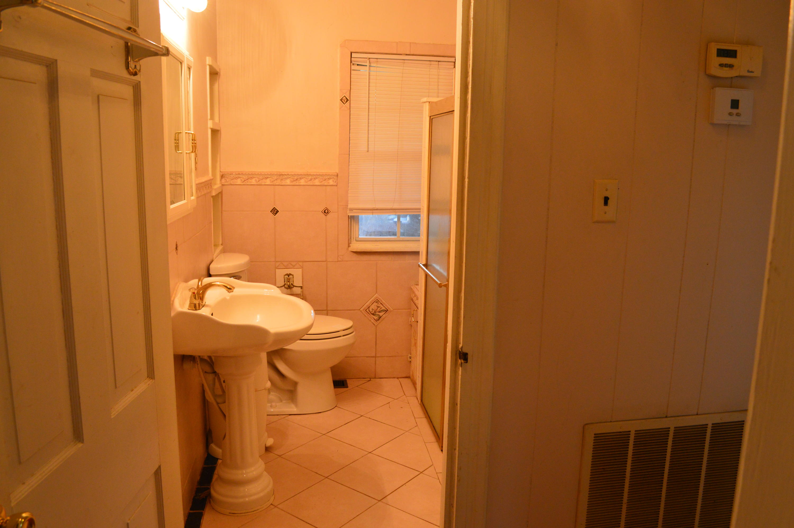 8745 Callands Road Chatham, VA 24531 - Photo 19 of 37 a bathroom with a sink a toilet and shower