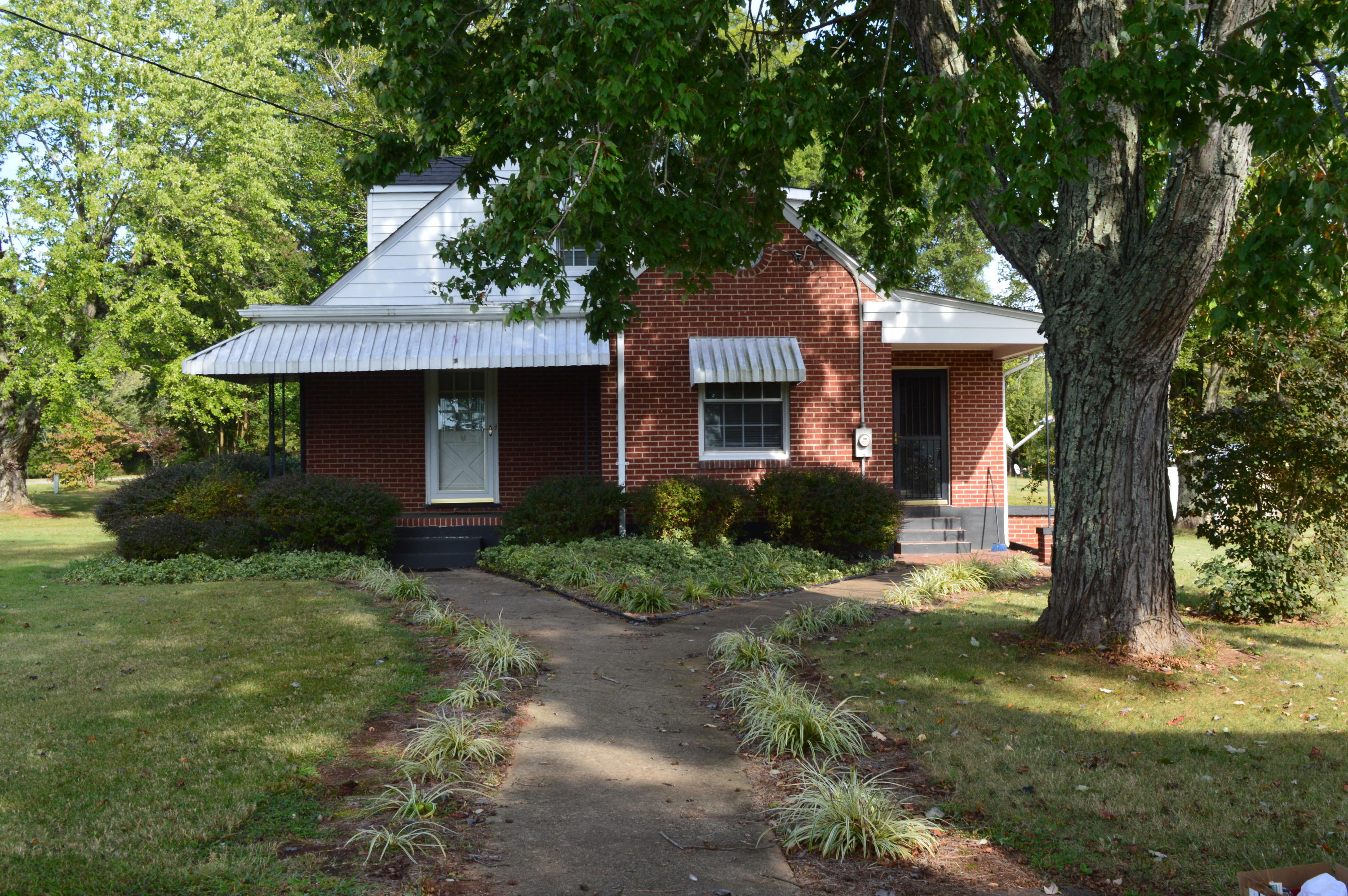 8745 Callands Road Chatham, VA 24531 - Photo 3 of 37 a front view of a house with garden