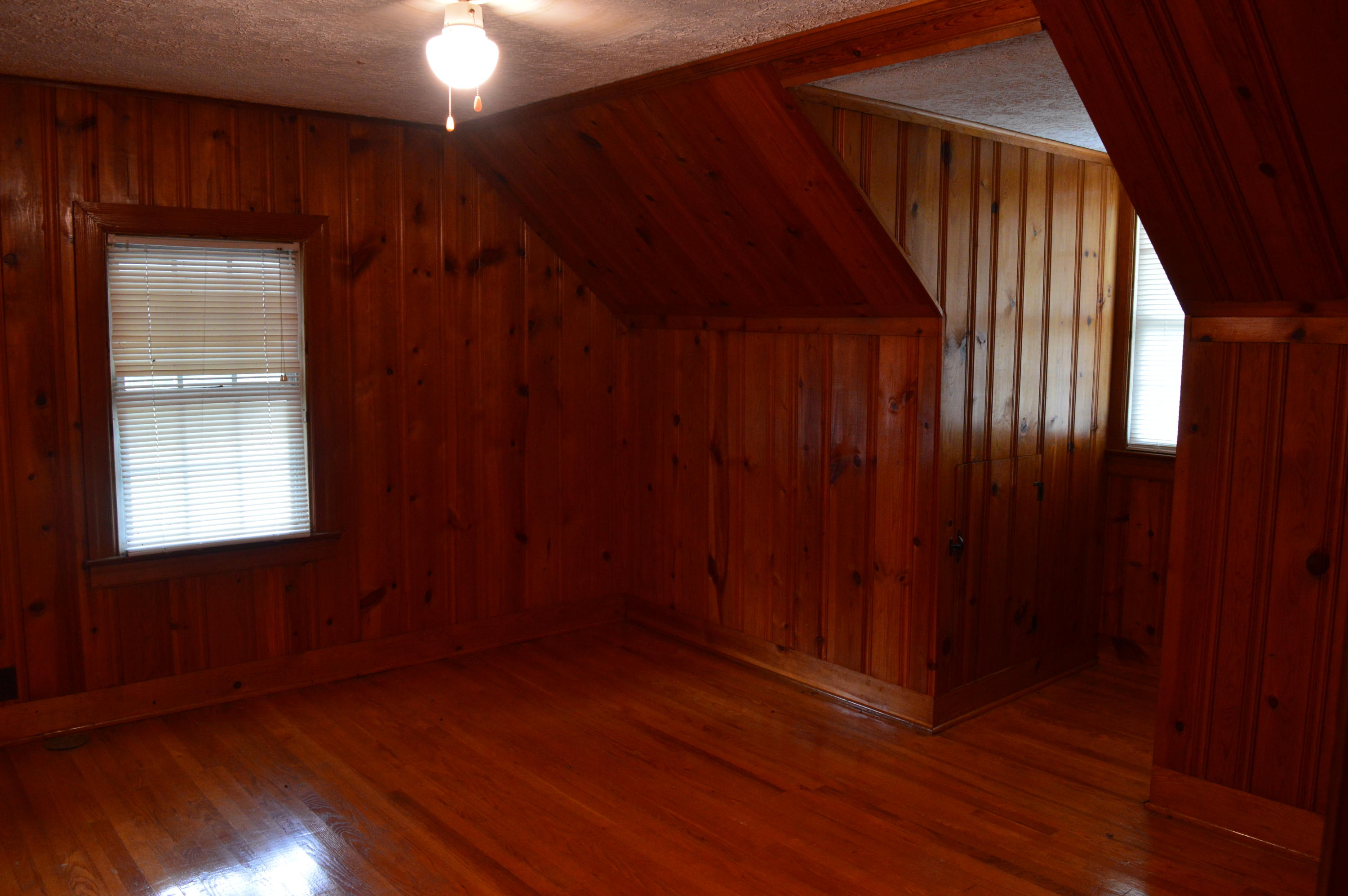 8745 Callands Road Chatham, VA 24531 - Photo 31 of 37 a view of an empty room with wooden floor and a window