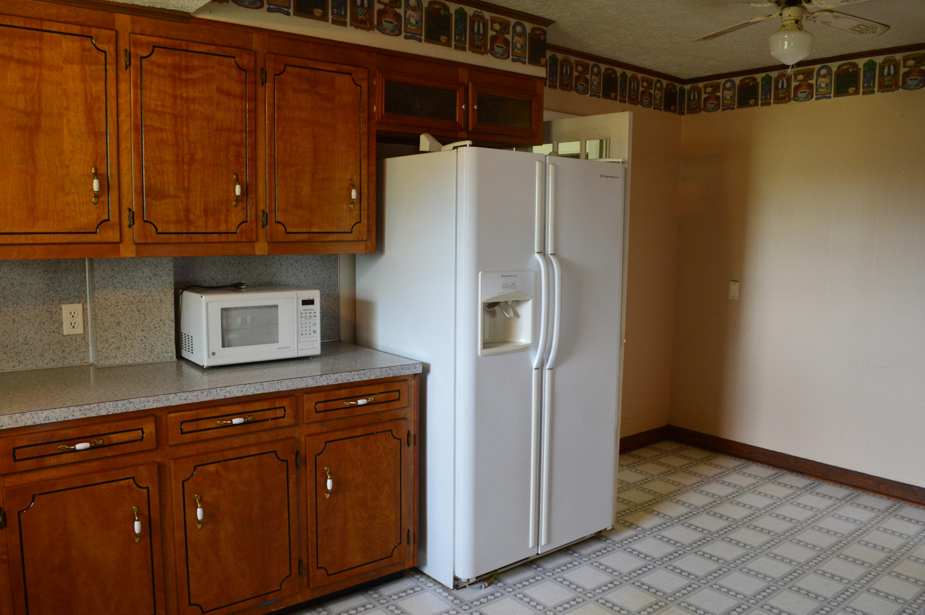 8745 Callands Road Chatham, VA 24531 - Photo 8 of 37 a kitchen with stainless steel appliances granite countertop a refrigerator and a cabinets