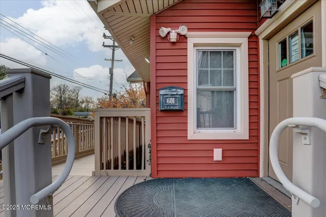 a view of a house with a wooden fence