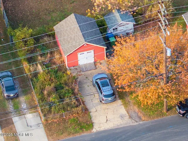 an aerial view of residential house with outdoor space and swimming pool
