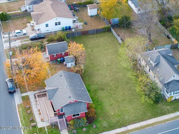 an aerial view of house with yard swimming pool and outdoor seating