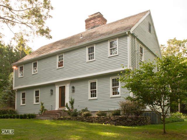 113 Castle Hill Road Newtown, CT 06470 - Photo 1 of 1 a front view of house with yard and green space