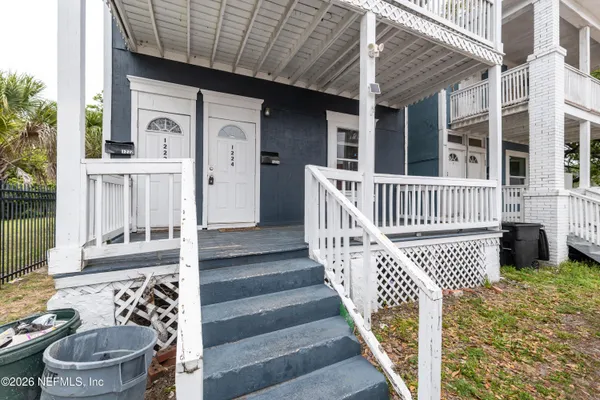 a view of a porch with furniture