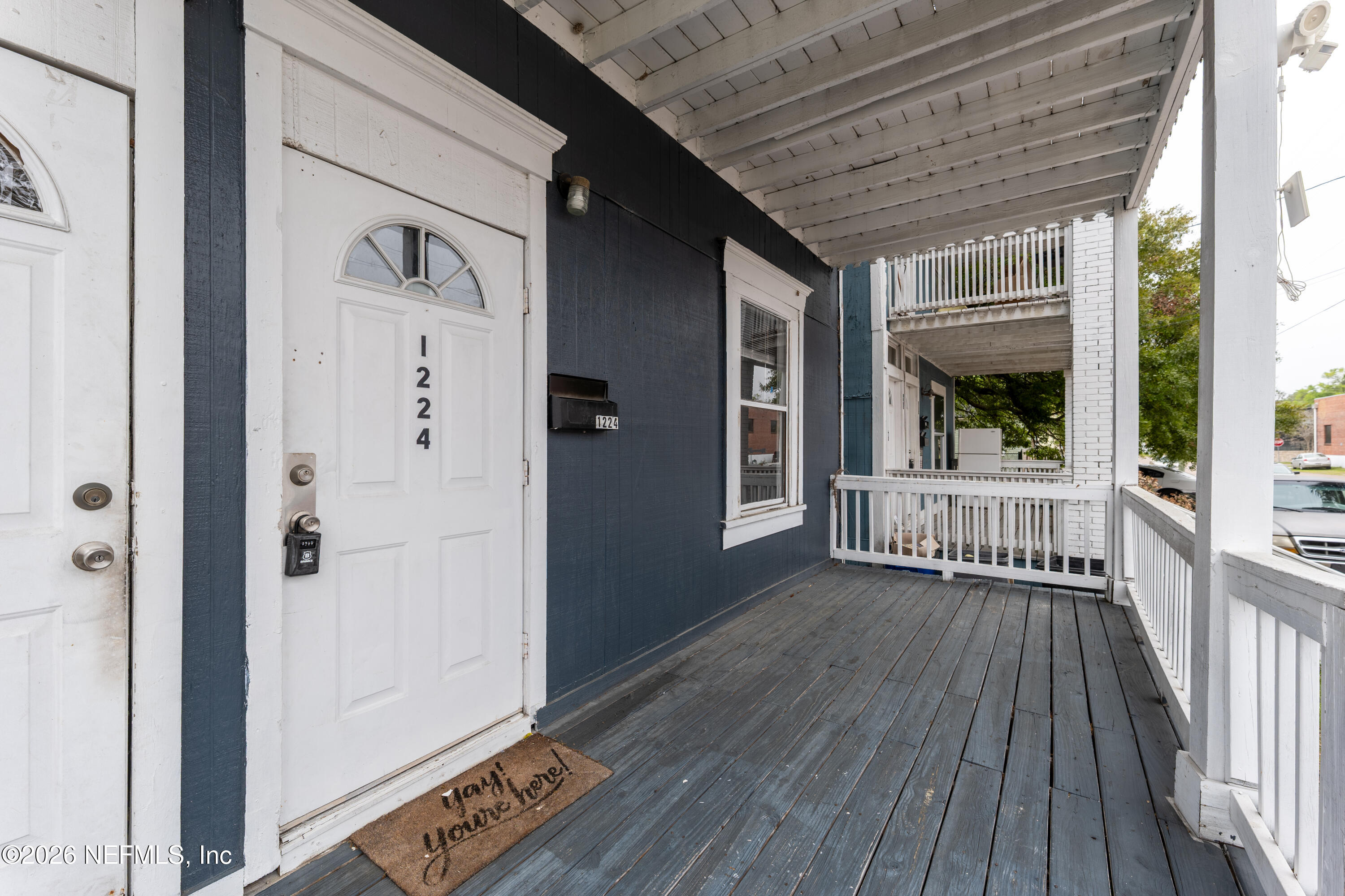 1222 Clark Street Jacksonville, FL 32206 - Photo 2 of 16 a view of a balcony with wooden floor