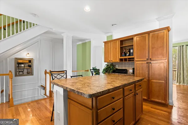a kitchen with stainless steel appliances a counter top space and a window