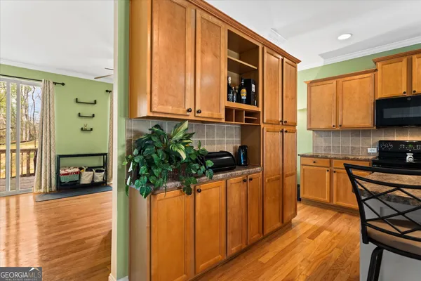 a bathroom with a sink mirror and a toilet