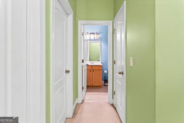 a bathroom with a sink and mirror