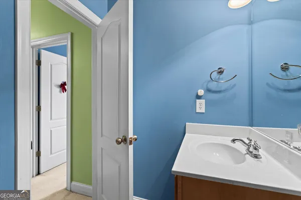 a bathroom with a sink and a mirror