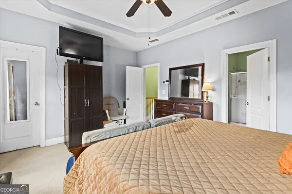 a bedroom with a bed and a cabinets