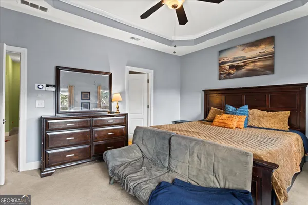 a bedroom with a bed furniture and a window