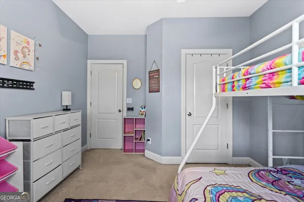 a bathroom with a sink and mirror with toilet