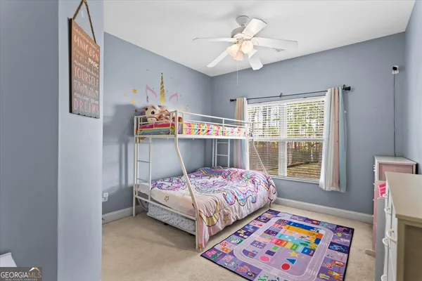 a view of a house with a porch and furniture