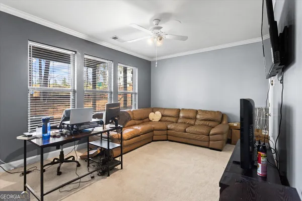 a view of a deck with wooden floor and roof with a garden