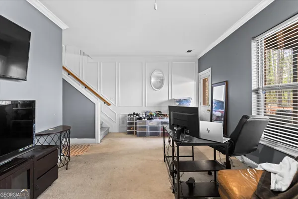 a view of a house with a yard and sitting area