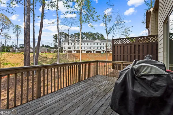 an aerial view of a house with street
