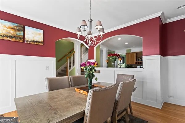 a dining room with furniture and window
