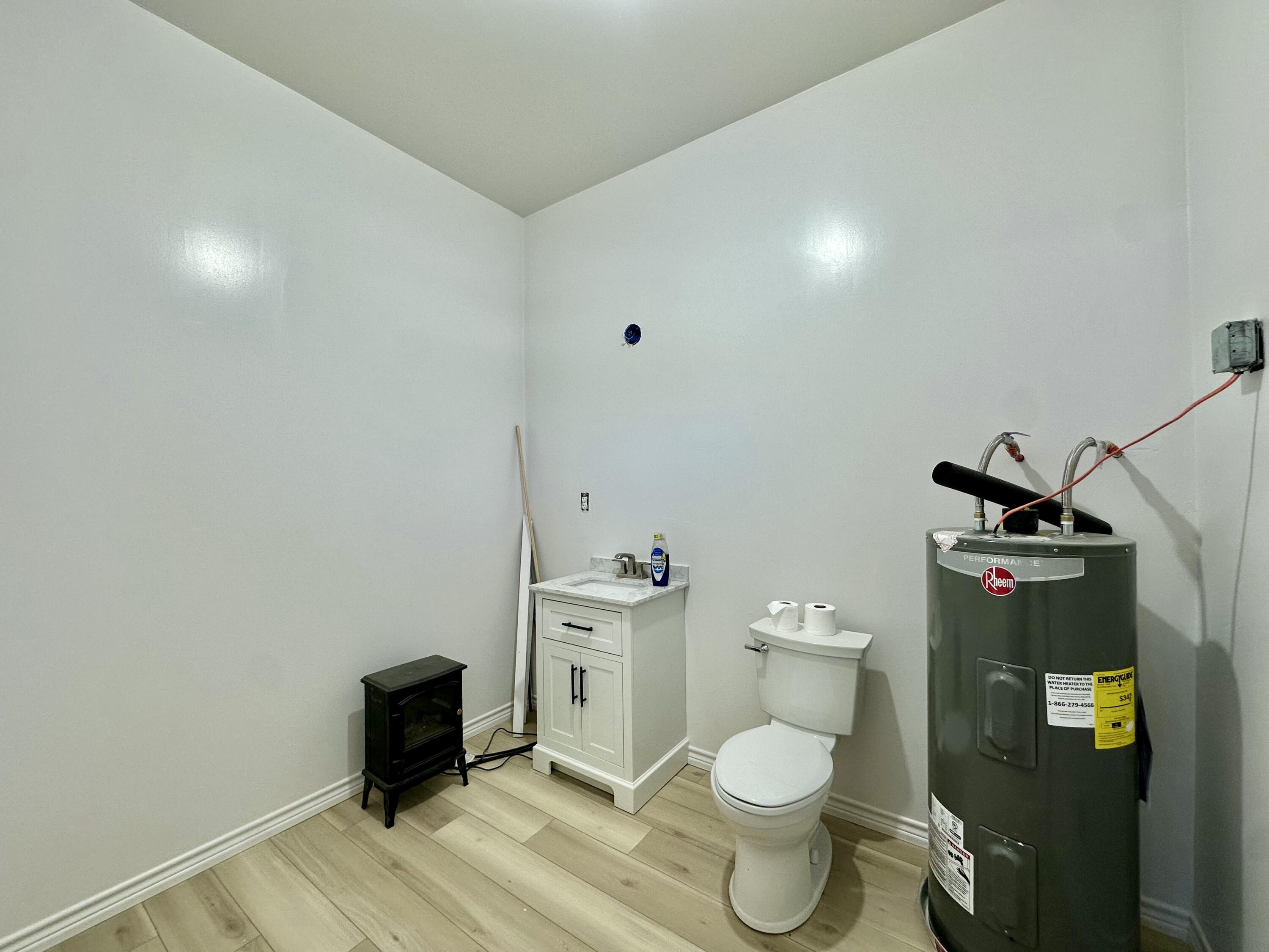308 Pierce Street Whiteface, TX 79346 - Photo 8 of 9 a bathroom with a toilet and a sink