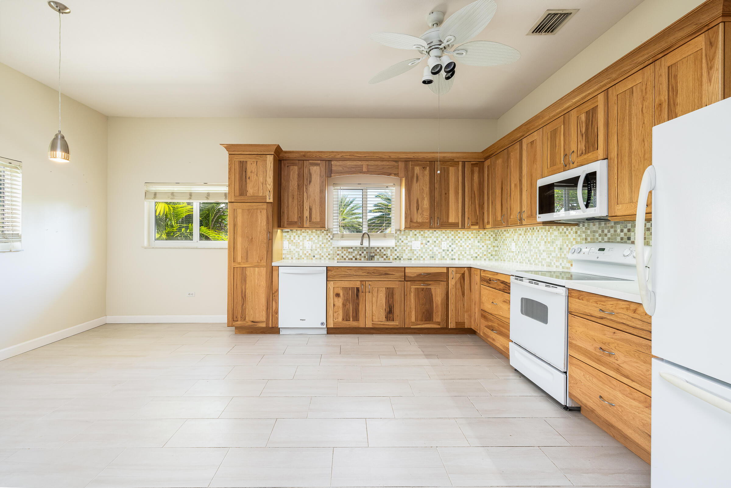 132 Galleon Road Islamorada, FL 33036 - Photo 10 of 38 a large kitchen with stainless steel appliances granite countertop a stove a sink and a microwave