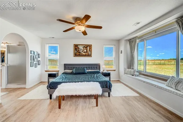 a bedroom with a bed and window