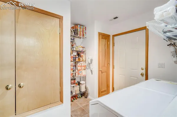 a view of utility room and washer and dryer