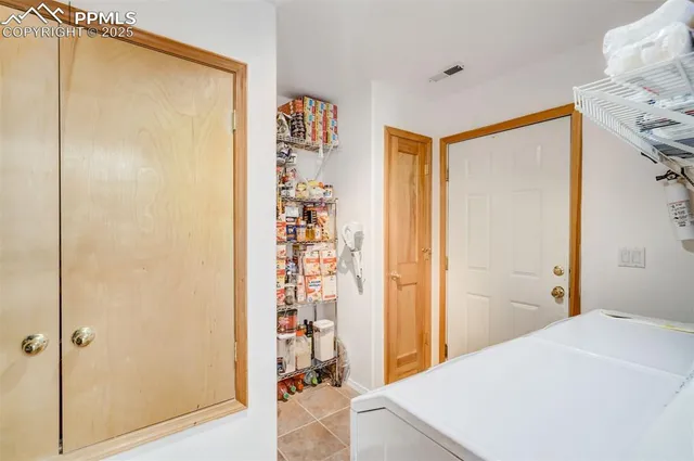a view of utility room and washer and dryer
