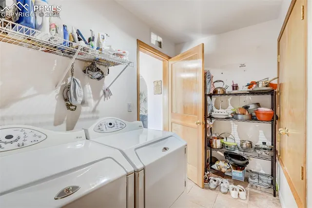 a view of a dining room with furniture and a chandelier