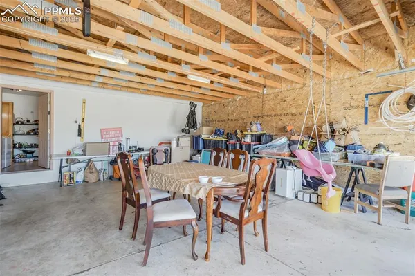 a view of a patio with a table and chairs