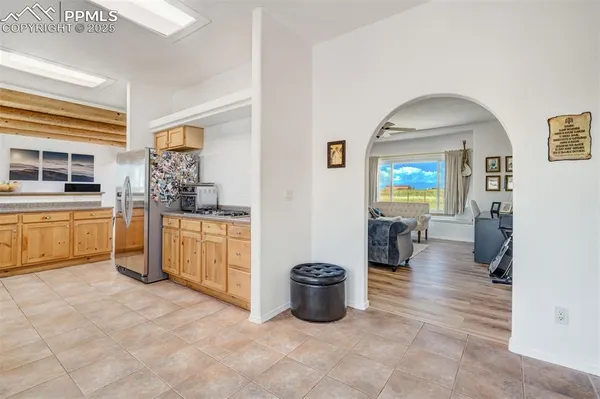 a kitchen with granite countertop a sink and cabinets