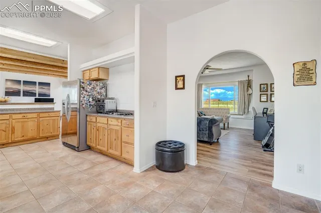 a kitchen with granite countertop a sink and cabinets