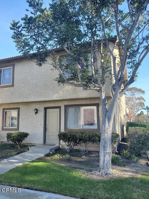 3077 Kelp Lane, Unit 108 Oxnard, CA 93035 - Photo 2 of 15 a front view of house with yard and green space