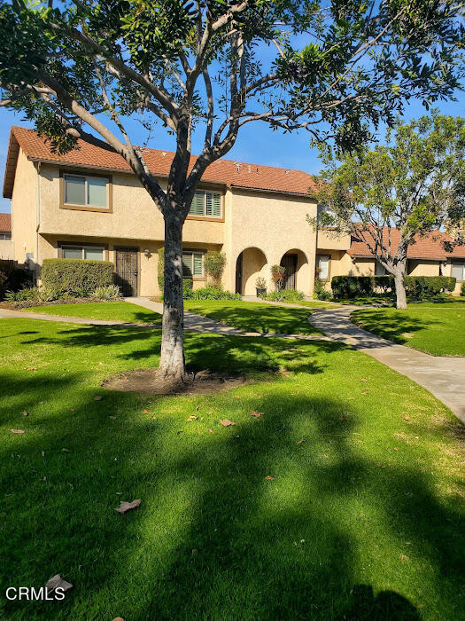 3077 Kelp Lane, Unit 108 Oxnard, CA 93035 - Photo 3 of 15 a front view of a house with garden