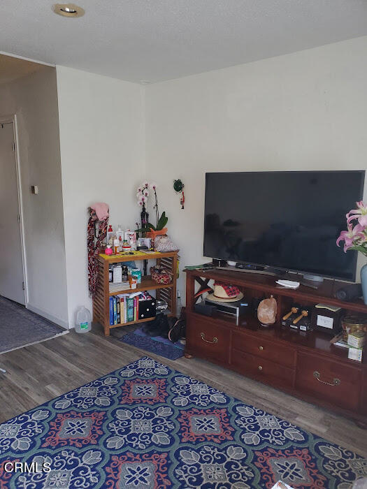 3077 Kelp Lane, Unit 108 Oxnard, CA 93035 - Photo 6 of 15 a living room with furniture and a flat screen tv