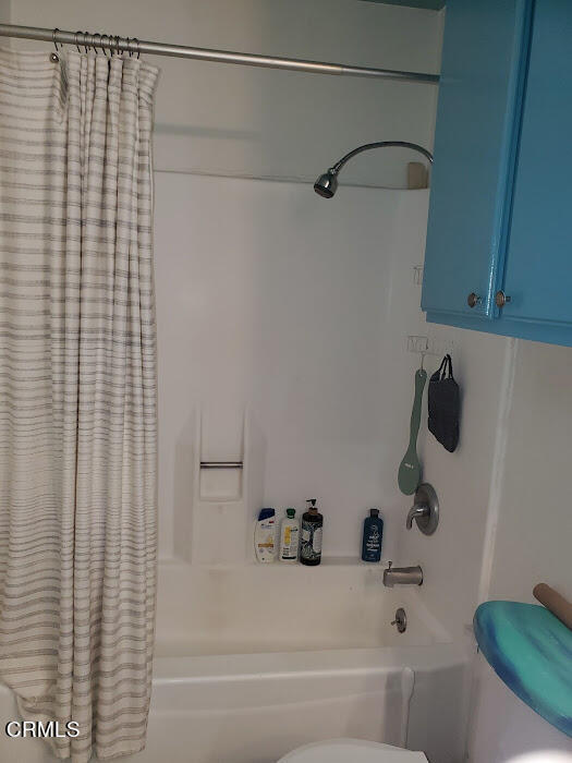 3077 Kelp Lane, Unit 108 Oxnard, CA 93035 - Photo 8 of 15 a bathroom with a shower and a bath tub