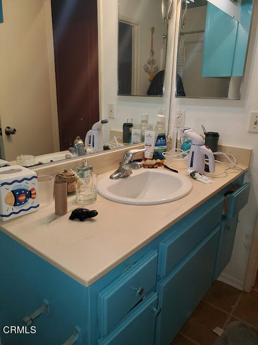 3077 Kelp Lane, Unit 108 Oxnard, CA 93035 - Photo 10 of 15 a bathroom with a sink and a mirror