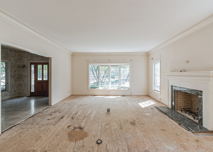 471 Stagecoach Run Glen Ellyn, IL 60137 - Photo 8 of 26 an empty room with windows and fireplace