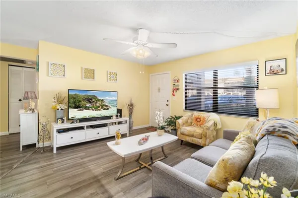 a living room with furniture and a flat screen tv
