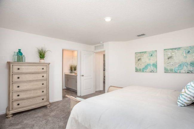 3392 East Odier Street Inverness, FL 34453 - Photo 13 of 24 a bedroom with a bed and a window